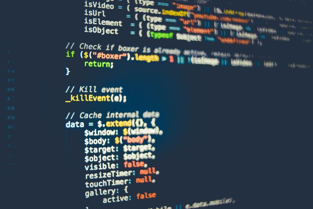 Home Close-up of colorful programming code displayed on a computer screen, showcasing modern coding concepts.